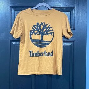 Boys timberland short sleeve shirt. Brown with black writing. Size large 14/16